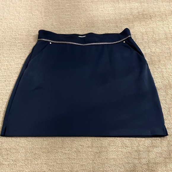 Great Greg Norman navy skort with navy and silver braid around waistband. - Picture 2 of 15